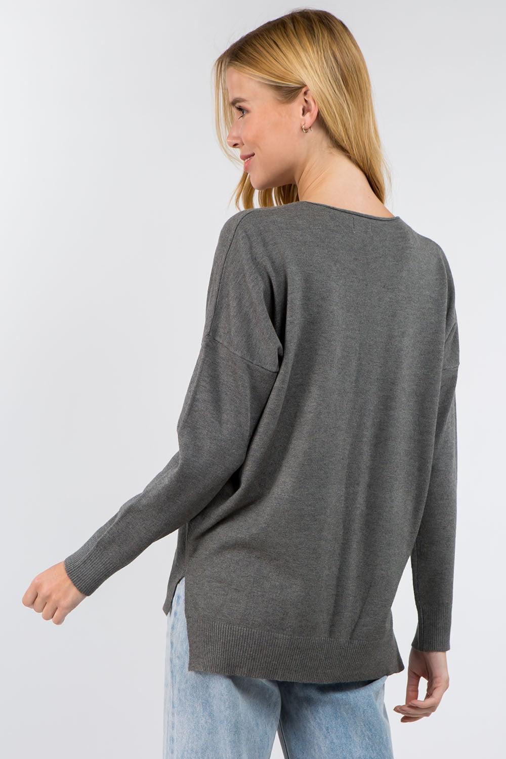 Vanessa Sweater showcasing its soft and luxurious fabric with a ribbed pattern, perfect for a stylish and comfortable outfit.