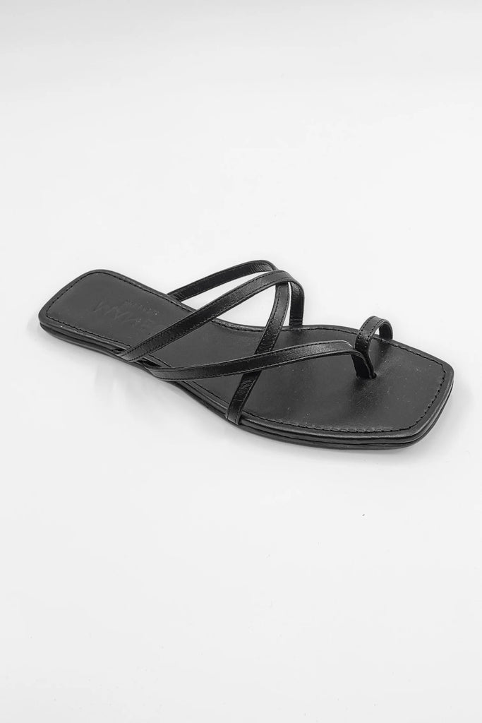 The Leandra Sandal displayed against a neutral background, highlighting its sleek design and convenient slip-on style.