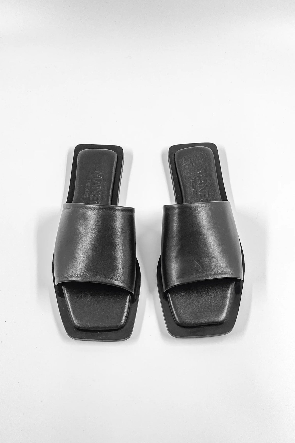 Lenny Sandals displayed in both suede and leather options, showcasing their luxurious materials and classic design.