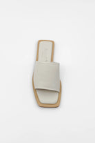 Lenny Sandals displayed in both suede and leather options, showcasing their luxurious materials and classic design.
