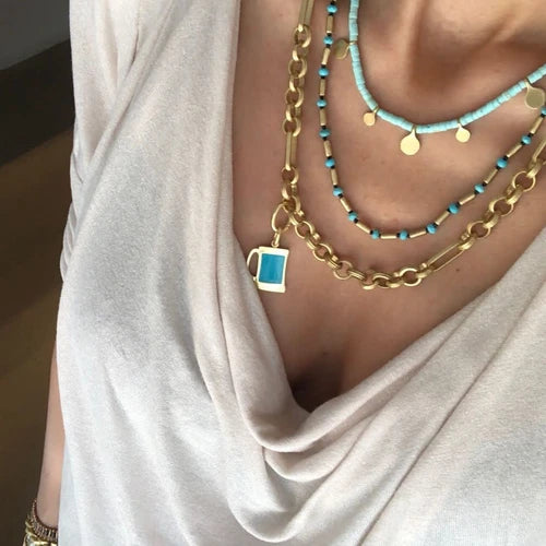 Bari Necklace: A coastal-inspired beauty, this necklace combines boho elegance with beachy vibes. The intricately crafted charms capture the essence of sun-soaked days, adding a touch of laid-back allure to your look.