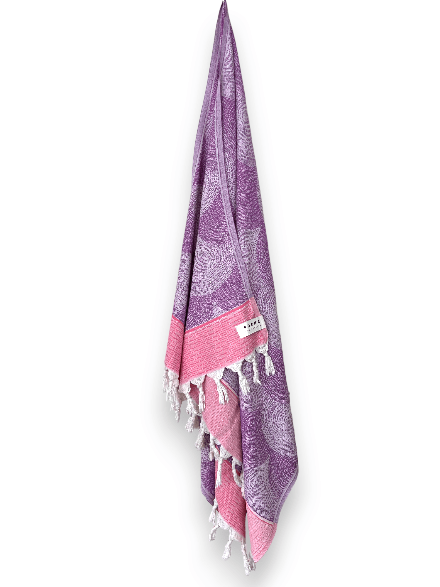 A set of Forma Towels from the Shell Collection, highlighting their soft, absorbent texture, ideal for both beach and home use.