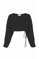 Siena Top displayed on a hanger, showcasing its wide sleeves and the unique V-shaped front drape with a hidden optional closure.