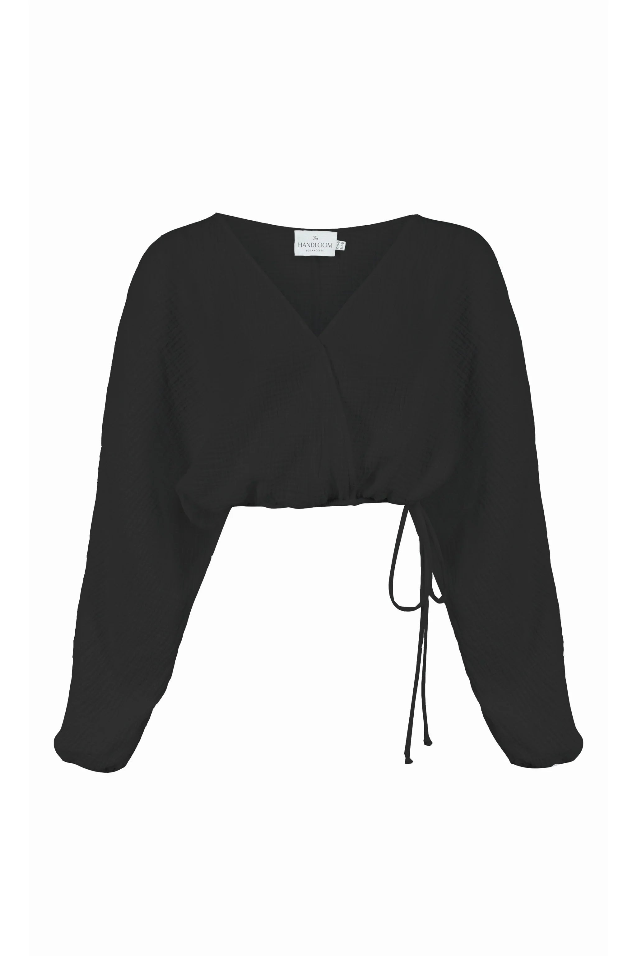 Siena Top displayed on a hanger, showcasing its wide sleeves and the unique V-shaped front drape with a hidden optional closure.