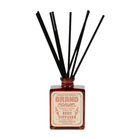 Grand Canyon reed diffuser with amber glass bottle and black reeds by Good & Well Supply Co., scented with cedarwood, labdanum, and charred pine.