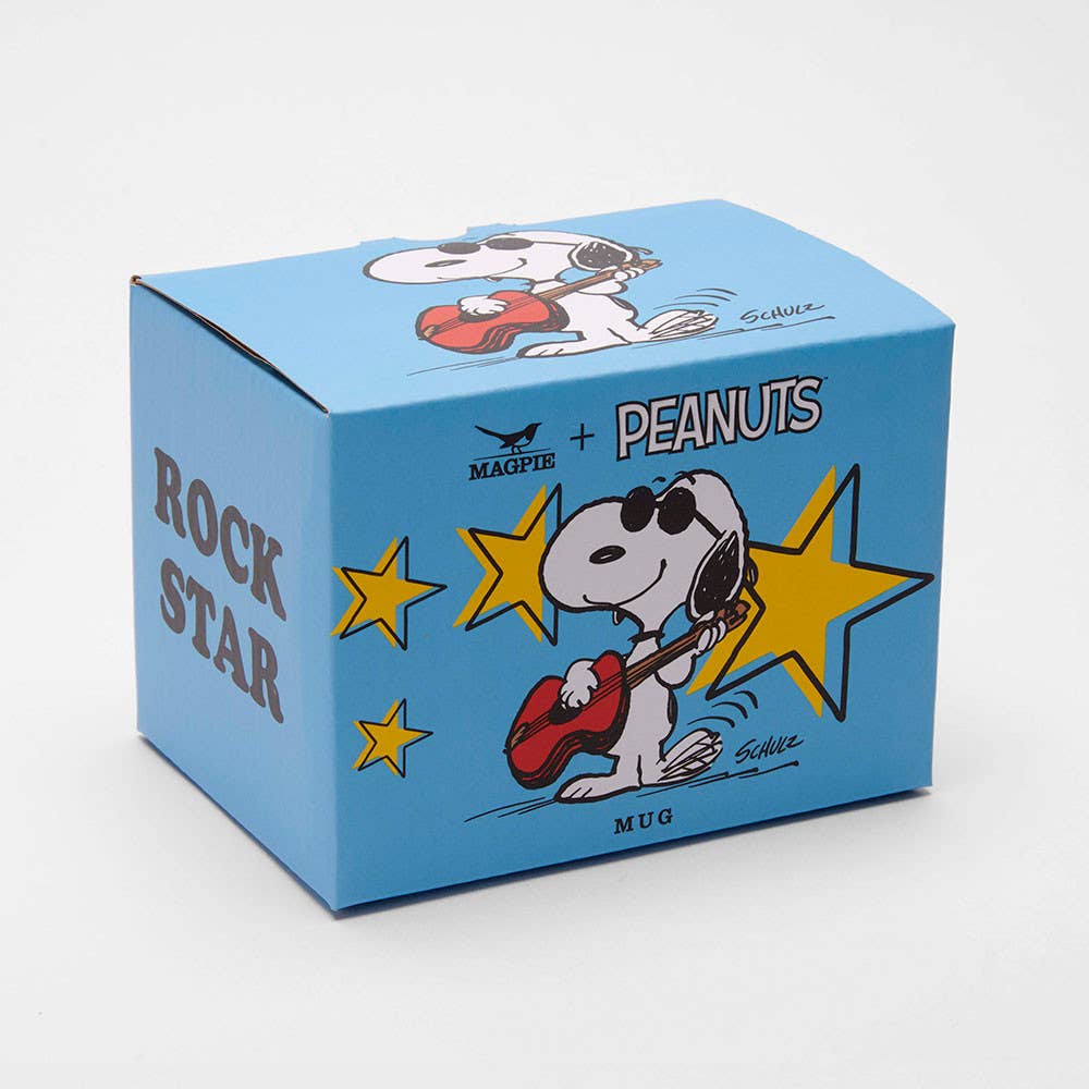 White ceramic mug with a red handle featuring a cool character playing a guitar, surrounded by yellow stars, with "Rock Star" printed on the back.