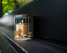 Chicago Candle: A lit candle emanating warmth and comfort, epitome of relaxation.
