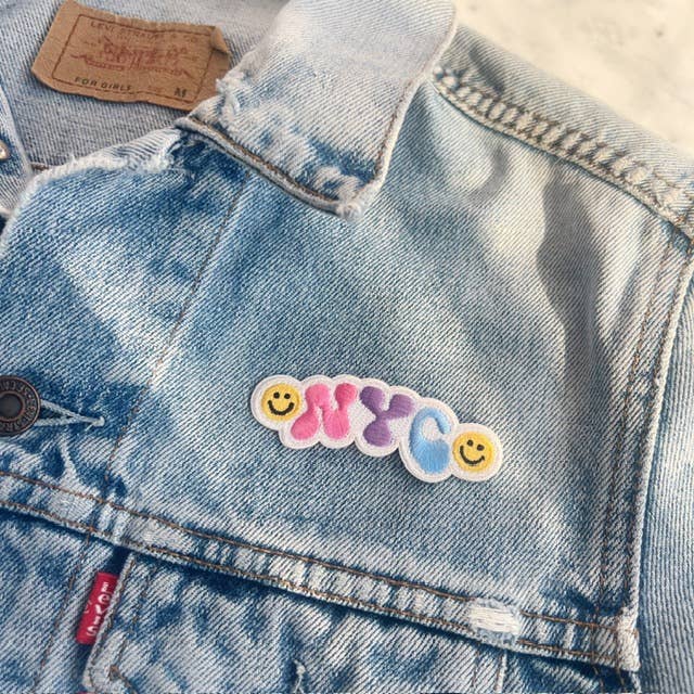 NYC Smiley Patch featuring a cheerful smiley face with the NYC skyline.