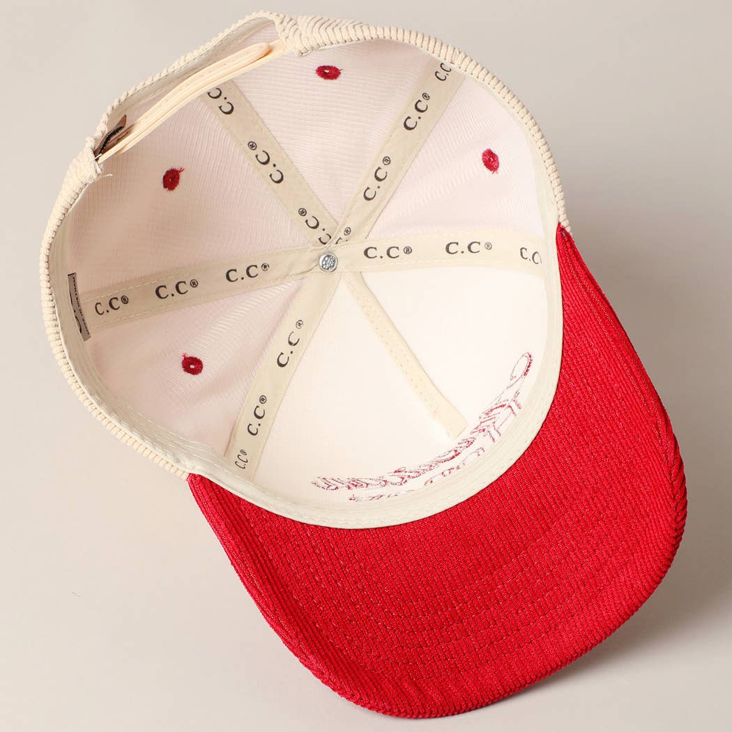 Corduroy trucker baseball cap with "American Honey" embroidered in red on cream and red fabric.