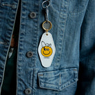 Peanuts Snoopy Smiley Key Tag - Snoopy with a big smile, a durable and charming key accessory spreading joy.