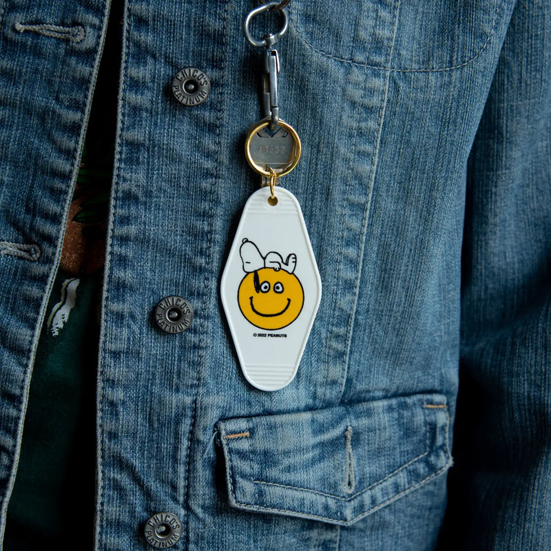Peanuts Snoopy Smiley Key Tag - Snoopy with a big smile, a durable and charming key accessory spreading joy.