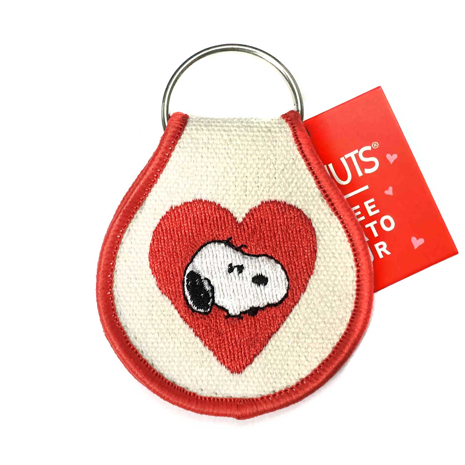 Peanuts® Valentine keychain featuring an embroidered Snoopy inside a red heart, bordered with red trim.