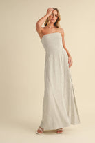 Back-tie strapless striped maxi dress with full-length skirt and bow detail