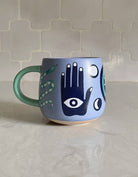 FORMA Ceramic Hamsa Mug - A blend of spirituality and artistry for uplifting coffee moments.