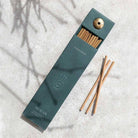 Natural incense sticks in a stylish green box with a built-in holder, designed for relaxation and mindfulness.