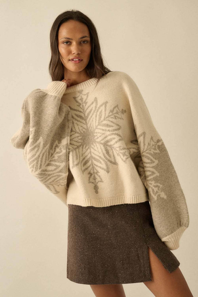 Oversized cream sweater with grey snowflake design.