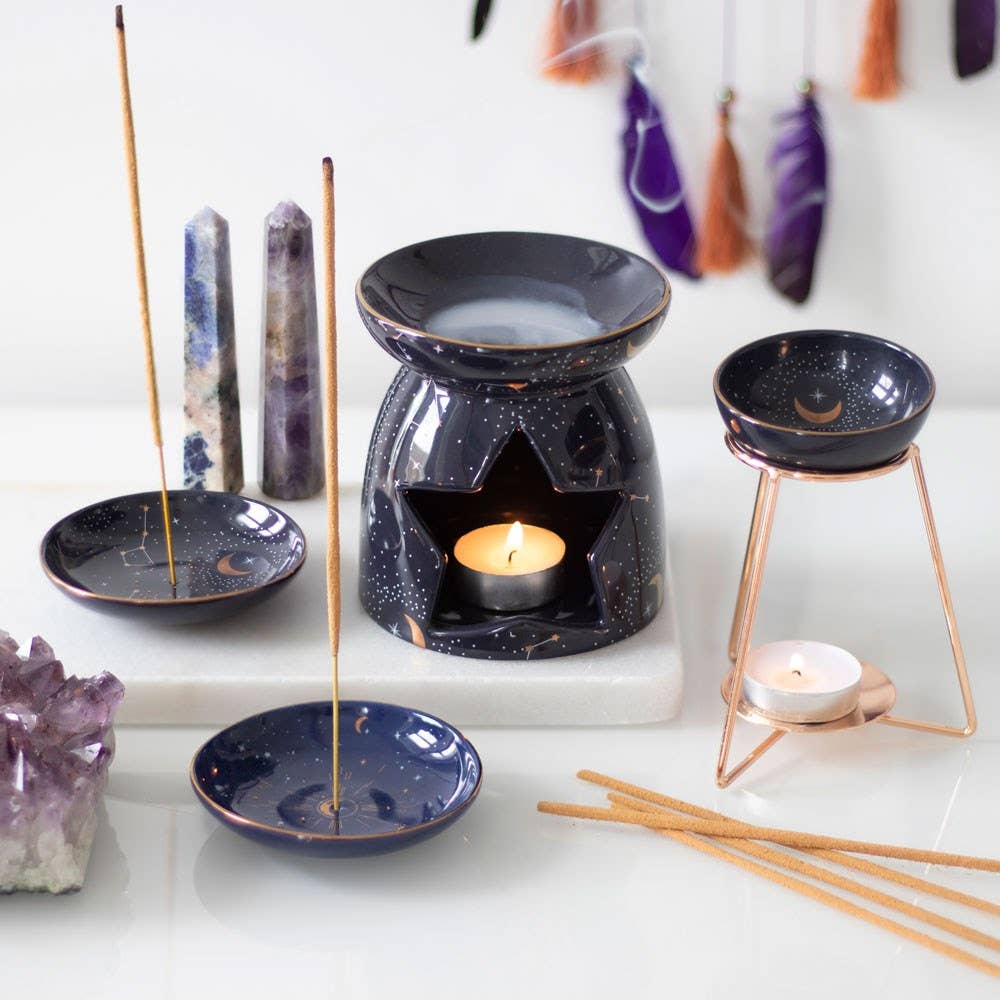 Starry Sky Incense Holder with gold accents and an incense stick.