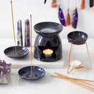 Starry Sky Incense Holder with gold accents and an incense stick.