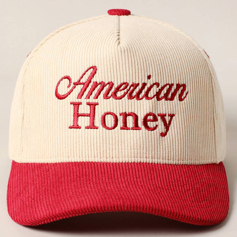 Corduroy trucker baseball cap with "American Honey" embroidered in red on cream and red fabric.