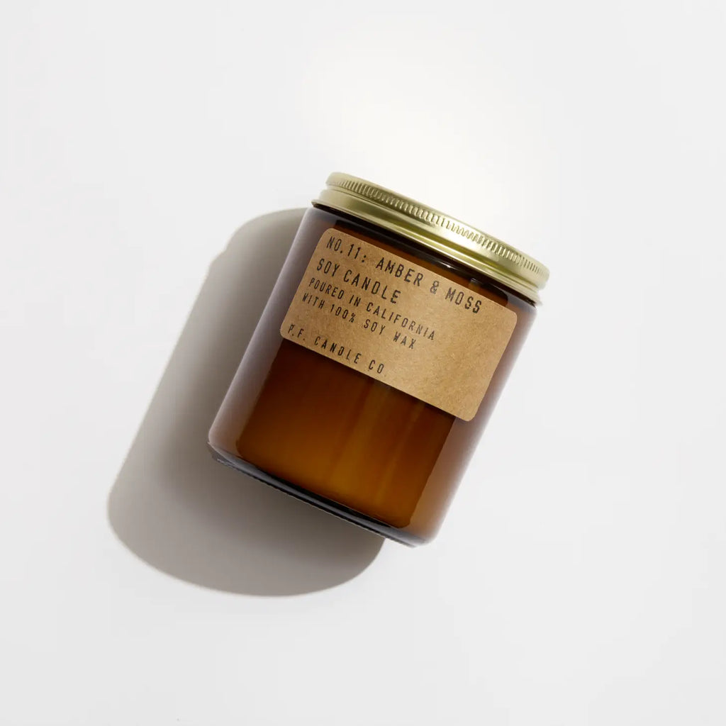 Amber & Moss Soy Candle, capturing the earthy essence of nature with its captivating fragrance.