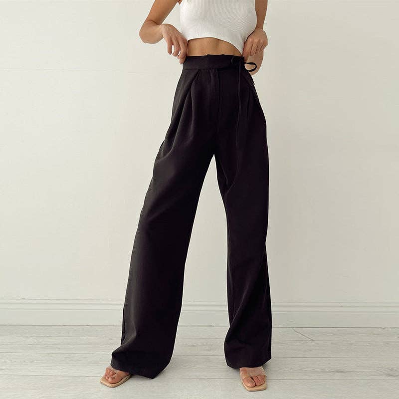 Woman wearing Urban Elegance Palazzo Pants in black color with a white crop top.