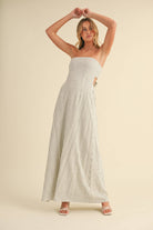 Back-tie strapless striped maxi dress with full-length skirt and bow detail