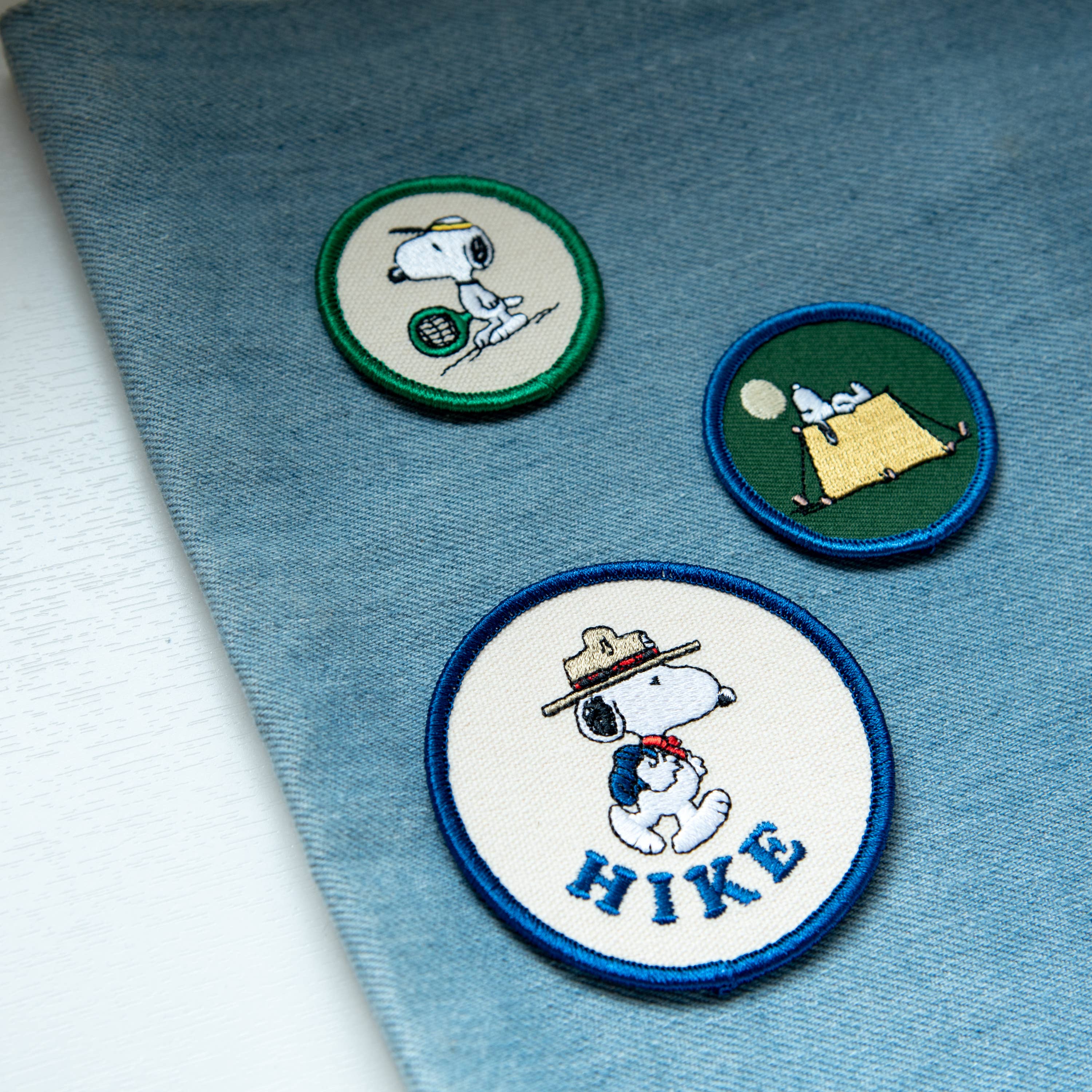 Peanuts® Snoopy Tennis Mini Patch featuring Snoopy holding a tennis racket.