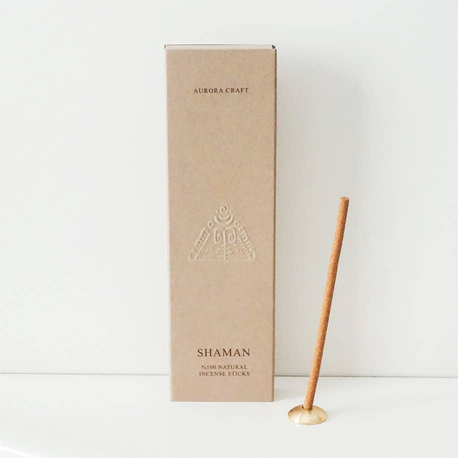 Shaman natural incense sticks in a taupe box with an embossed tribal symbol and built-in holder for grounding and spiritual balance.