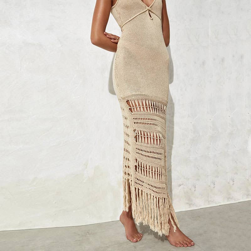 Woman wearing a Seaside Serenity Crochet Cover-Up Dress with a crochet design, adjustable spaghetti straps, and a fringe hem.