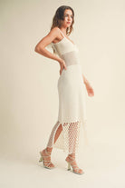 Model wearing the Maren Knitted Dress with delicate straps, mesh waist detail, and open-stitch hem.