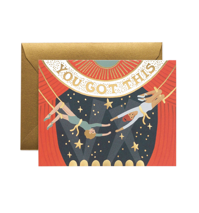 "You Got This" greeting card with a circus trapeze theme, gold foil lettering, and a matching gold envelope.