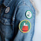 Peanuts® Snoopy Tennis Mini Patch featuring Snoopy holding a tennis racket.