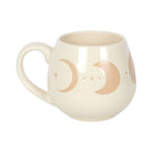 Ivory mug with moon phase design and cork coaster.