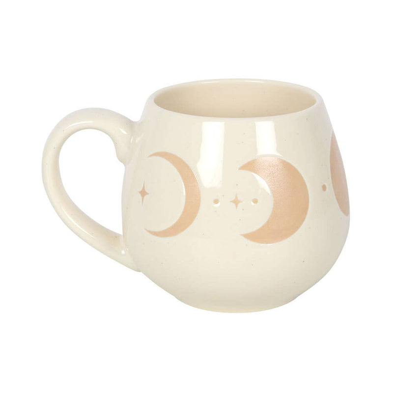 Ivory mug with moon phase design and cork coaster.