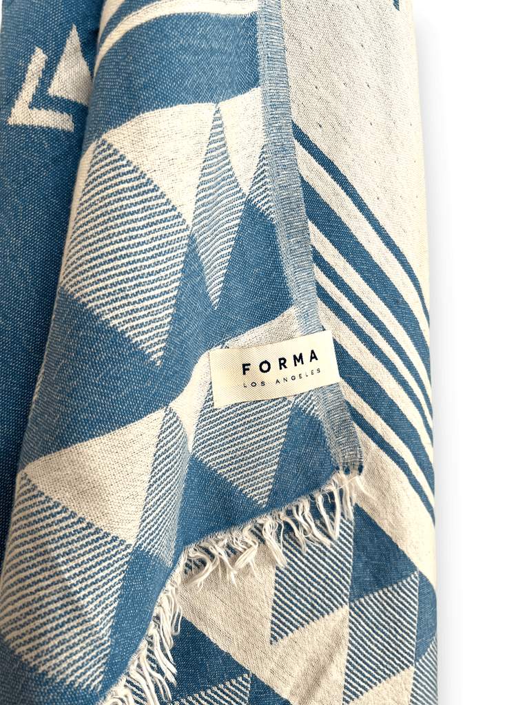 A set of Forma Towels from the Yosemite Collection, showing their soft, absorbent texture, suitable for beach or home use.