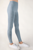 Fashion-forward woman showcasing the flattering fit and versatile style of FORMA's Ryder Jeggings.