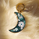 Botanical Moon Enamel Keychain, showcasing the beautiful combination of the moon and botanical elements in a detailed design.