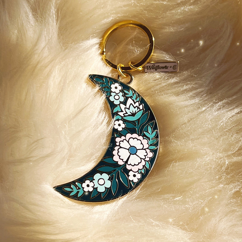 Botanical Moon Enamel Keychain, showcasing the beautiful combination of the moon and botanical elements in a detailed design.