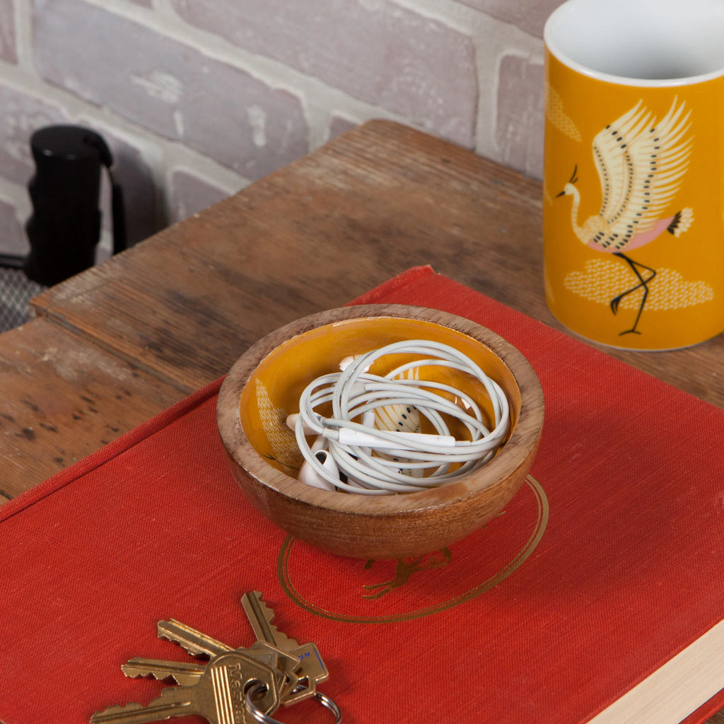 Image of Crane Mango Wood Mini Bowl, highlighting its unique wood grain on a neutral background.