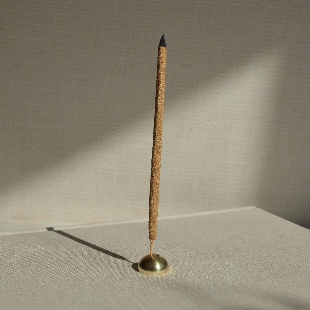 A stylish Brass Arch Incense Holder on a sleek backdrop, exuding modern elegance, designed to hold incense effortlessly.