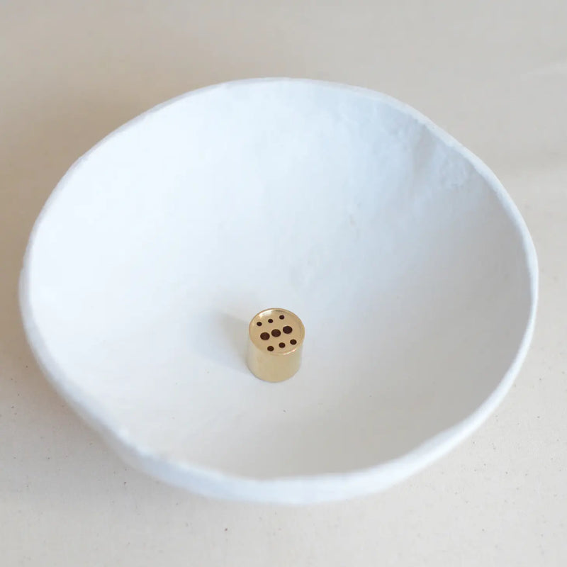 Polished Brass Round Incense Holder with a minimalist design, placed on a serene backdrop, perfect for holding your favorite incense.