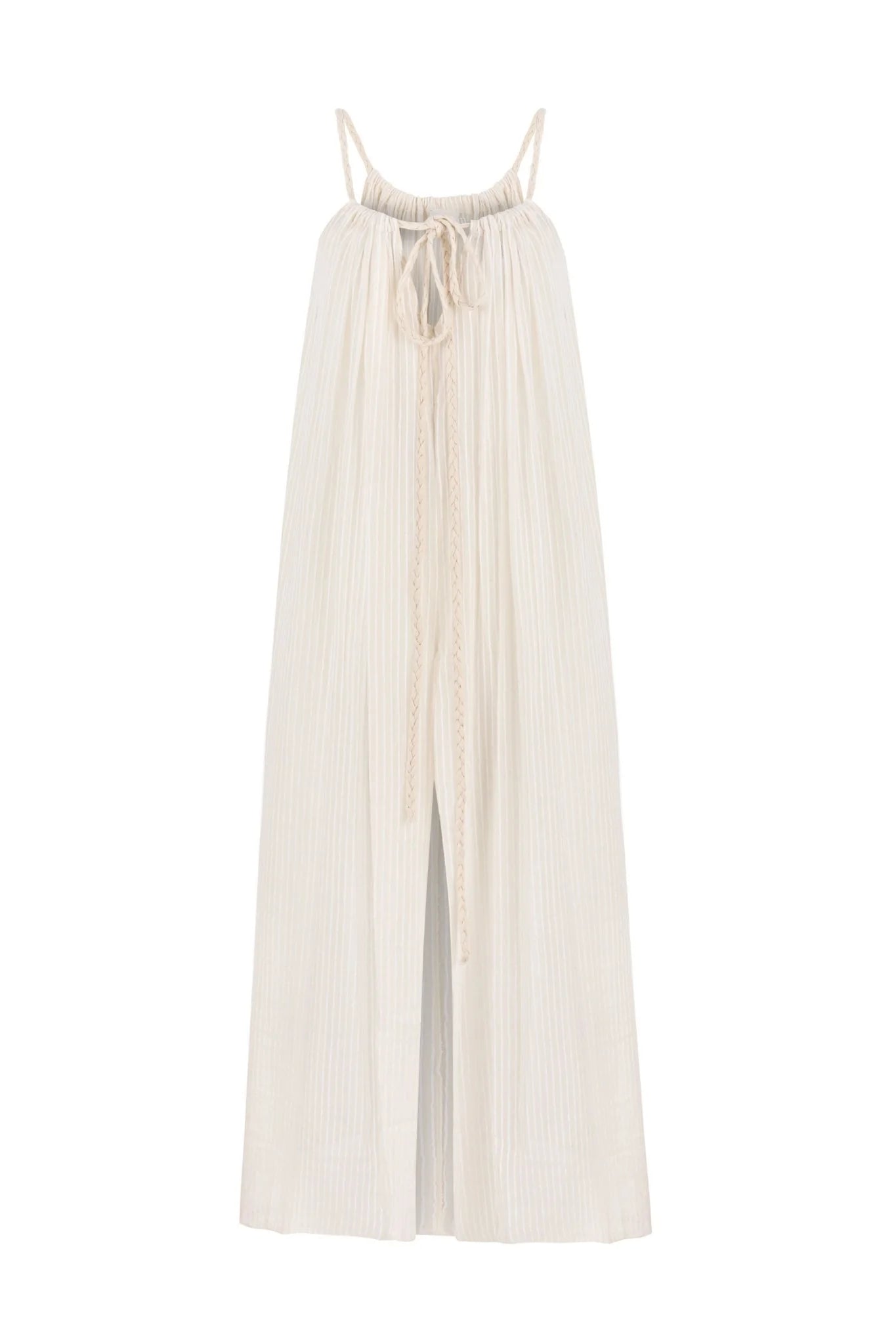 A woman wearing the Breeze Beach Dress, showcasing its relaxed and flowy silhouette, adjustable straps, and vibrant colors, perfect for a beach getaway.