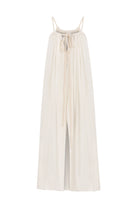 A woman wearing the Breeze Beach Dress, showcasing its relaxed and flowy silhouette, adjustable straps, and vibrant colors, perfect for a beach getaway.