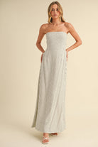 Back-tie strapless striped maxi dress with full-length skirt and bow detail