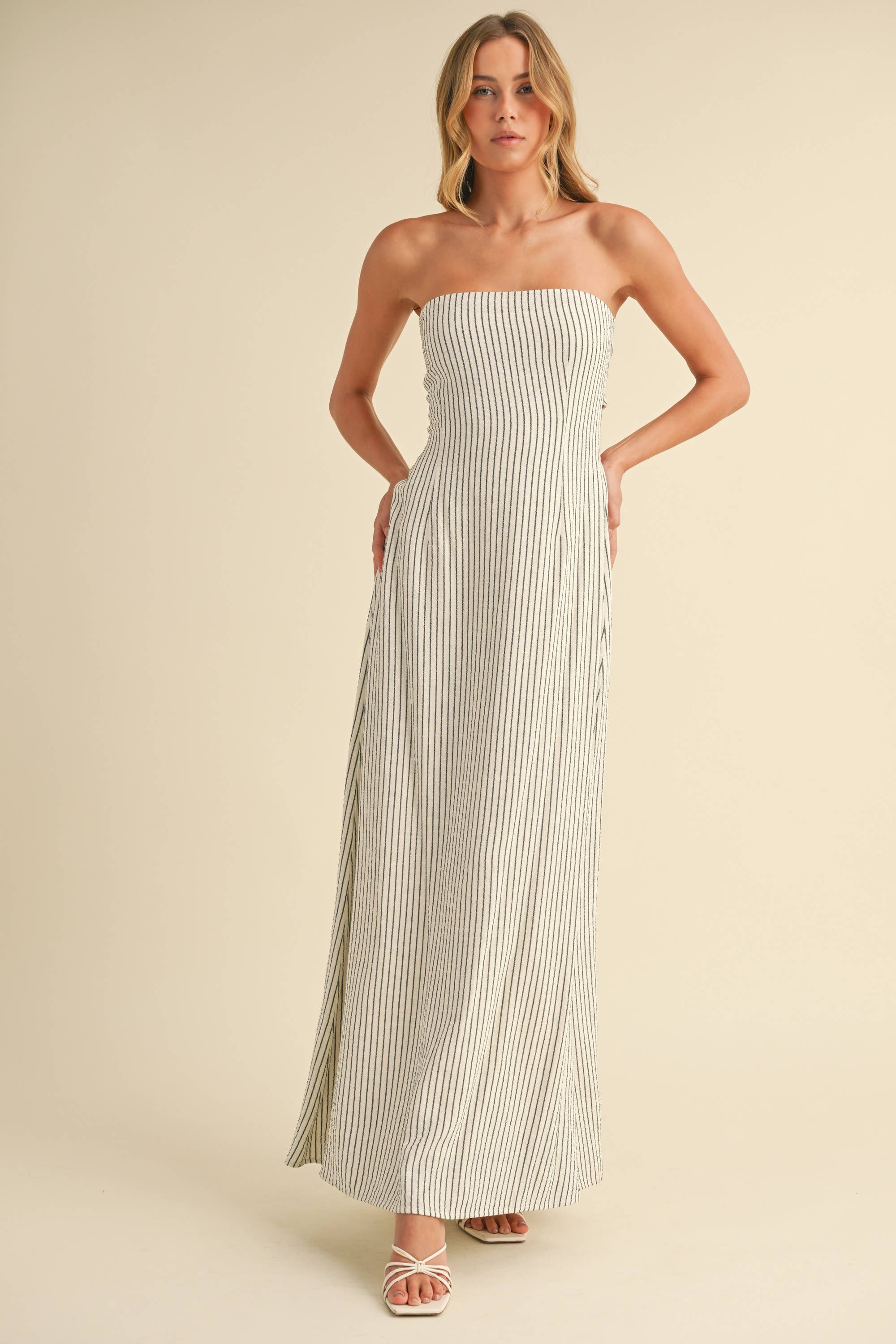Back-tie strapless striped maxi dress with full-length skirt and bow detail