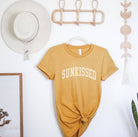 Sunkissed T-Shirt: White shirt with a large sun design.