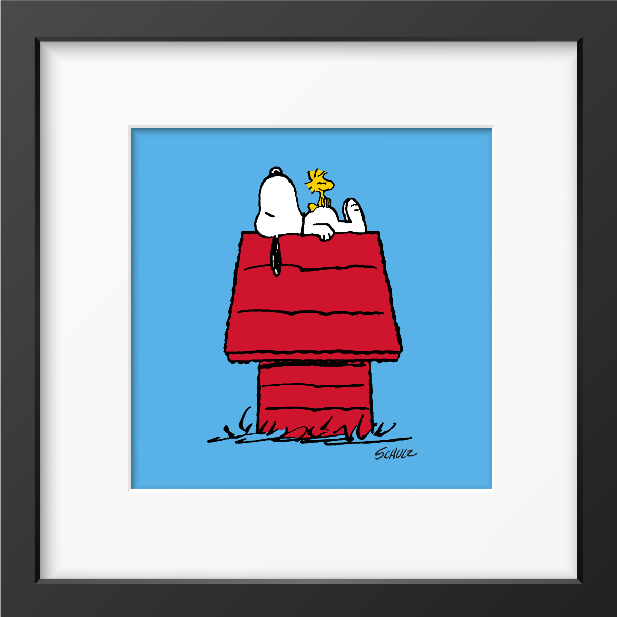 Framed print of Snoopy resting on his red doghouse with Woodstock perched beside him.