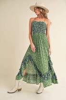 Panoramic view of the enchanting Deeane Ruffle Dress in vibrant green with floral pattern.