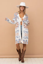 A stylish Erica Aztec Pattern Cardigan draped on a hanger.