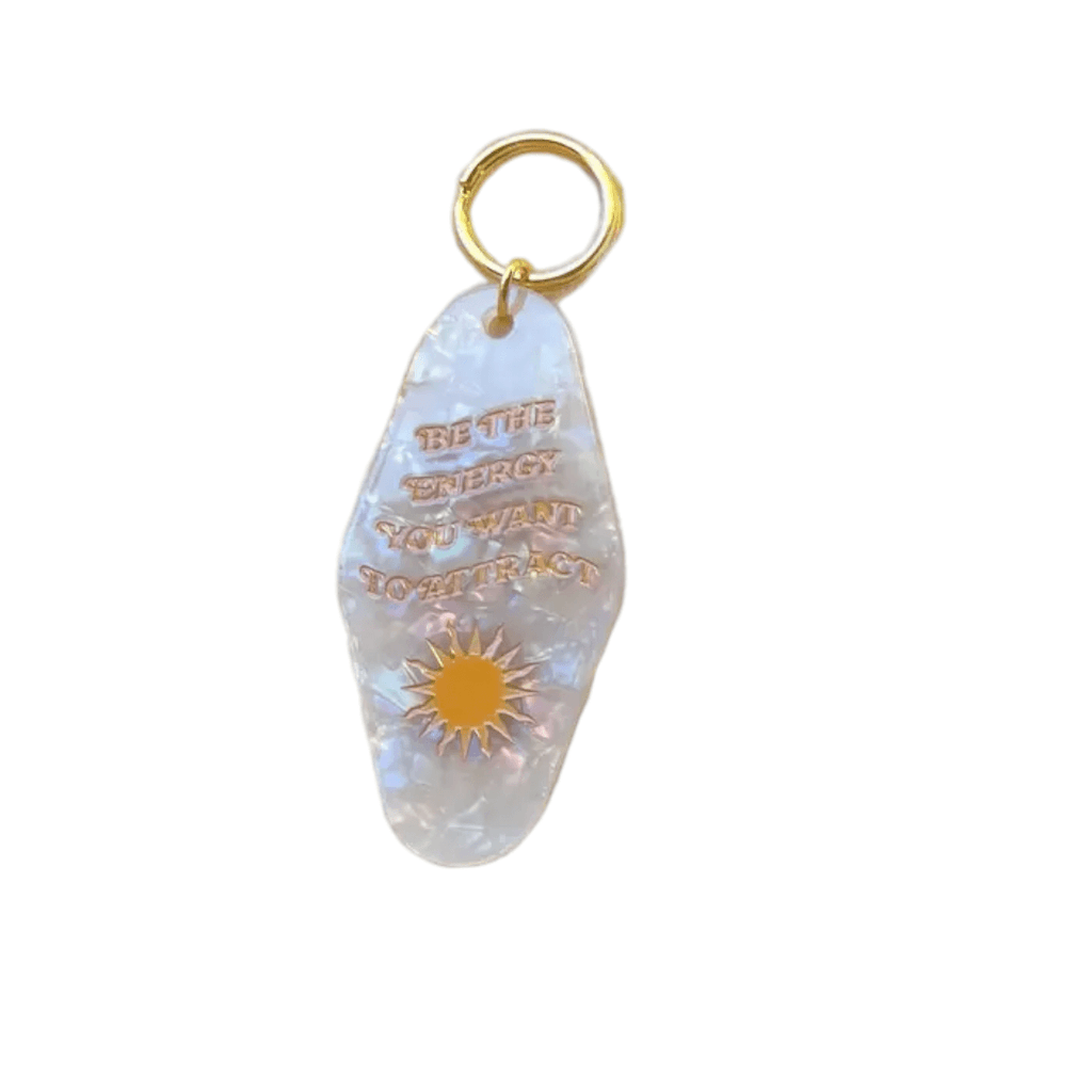 Cute Motel Keychain with vibrant design and an inspiring positive quote, adding a touch of retro and cheer to daily life.